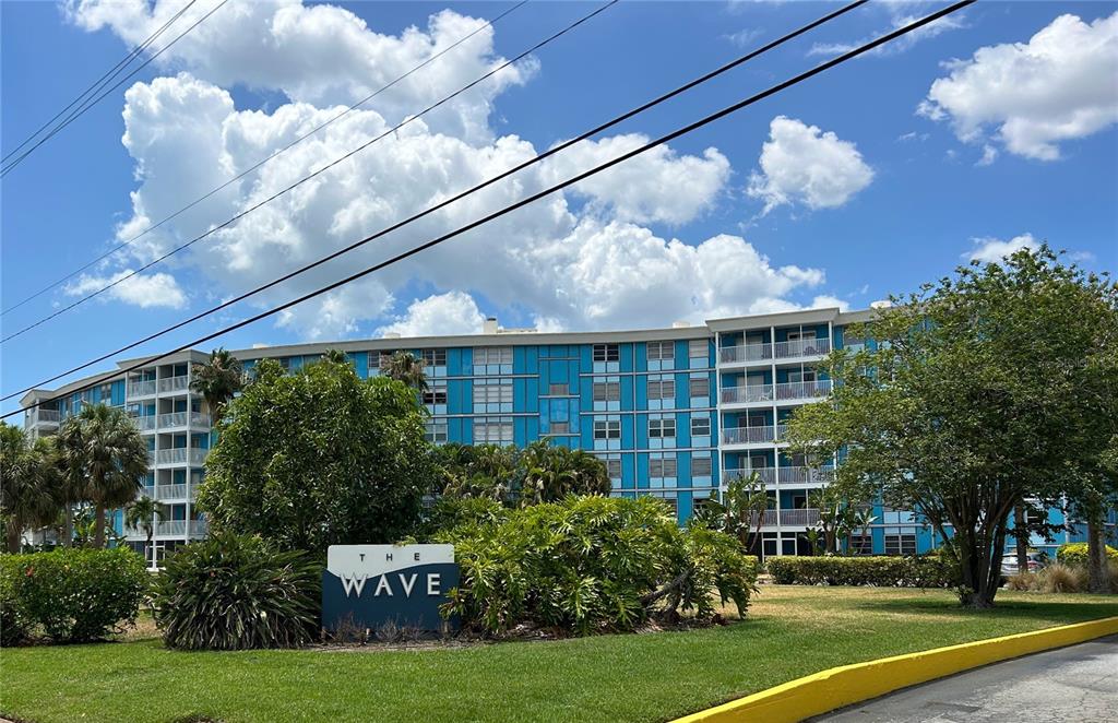 a view of a building with a yard