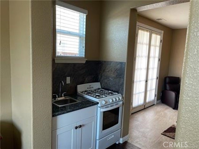 a kitchen with a stove and a microwave