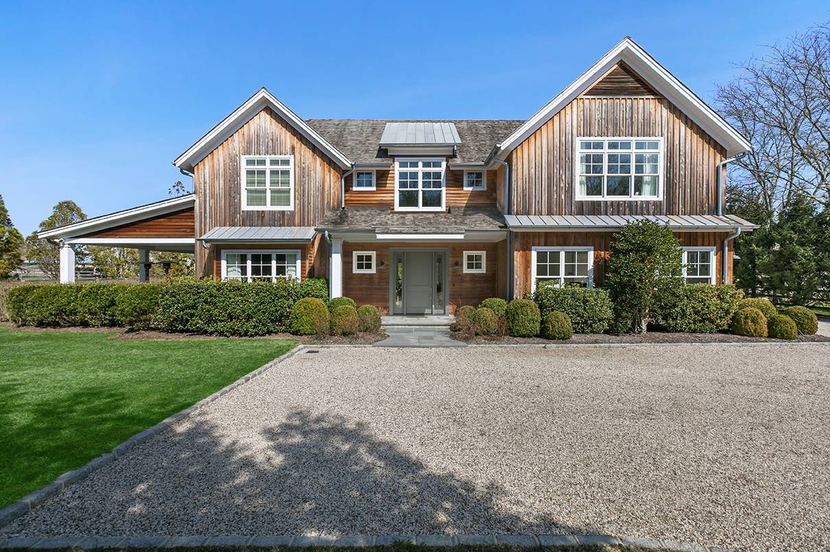 a front view of a house with yard