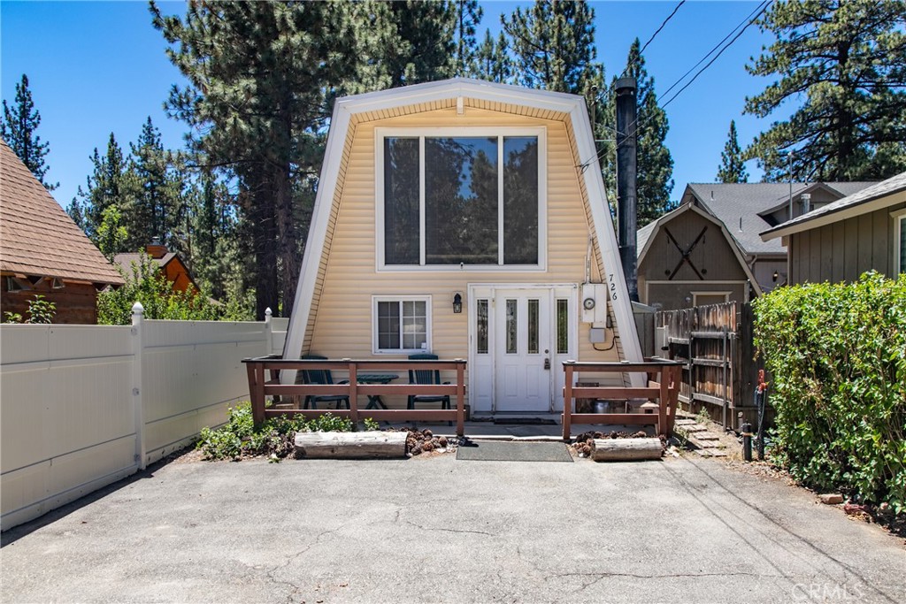 a view of a house with outdoor kitchen outdoor seating area