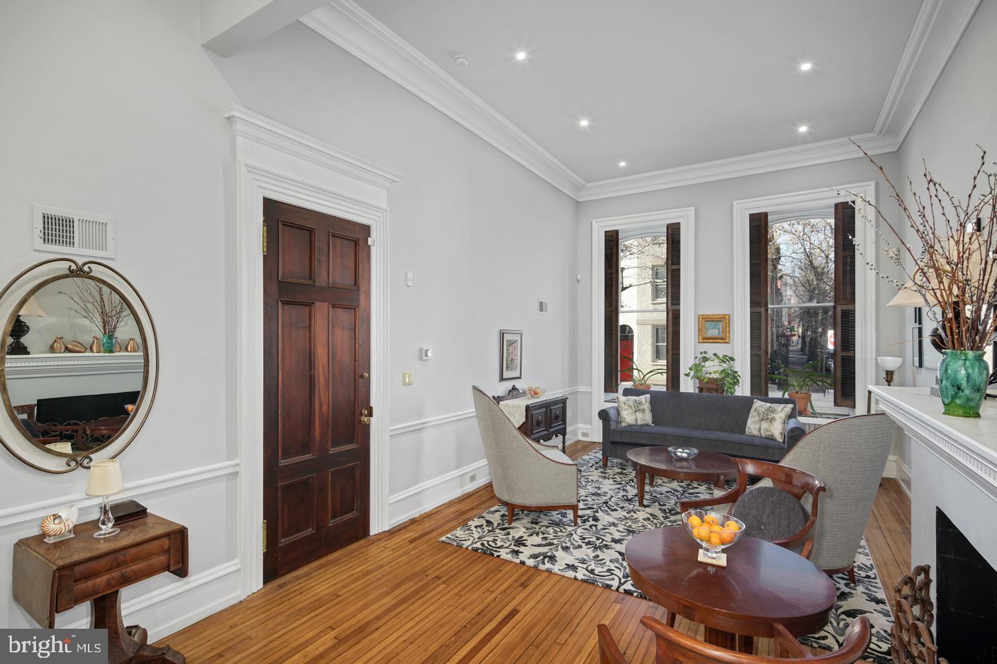 a living room with furniture a window and a fireplace