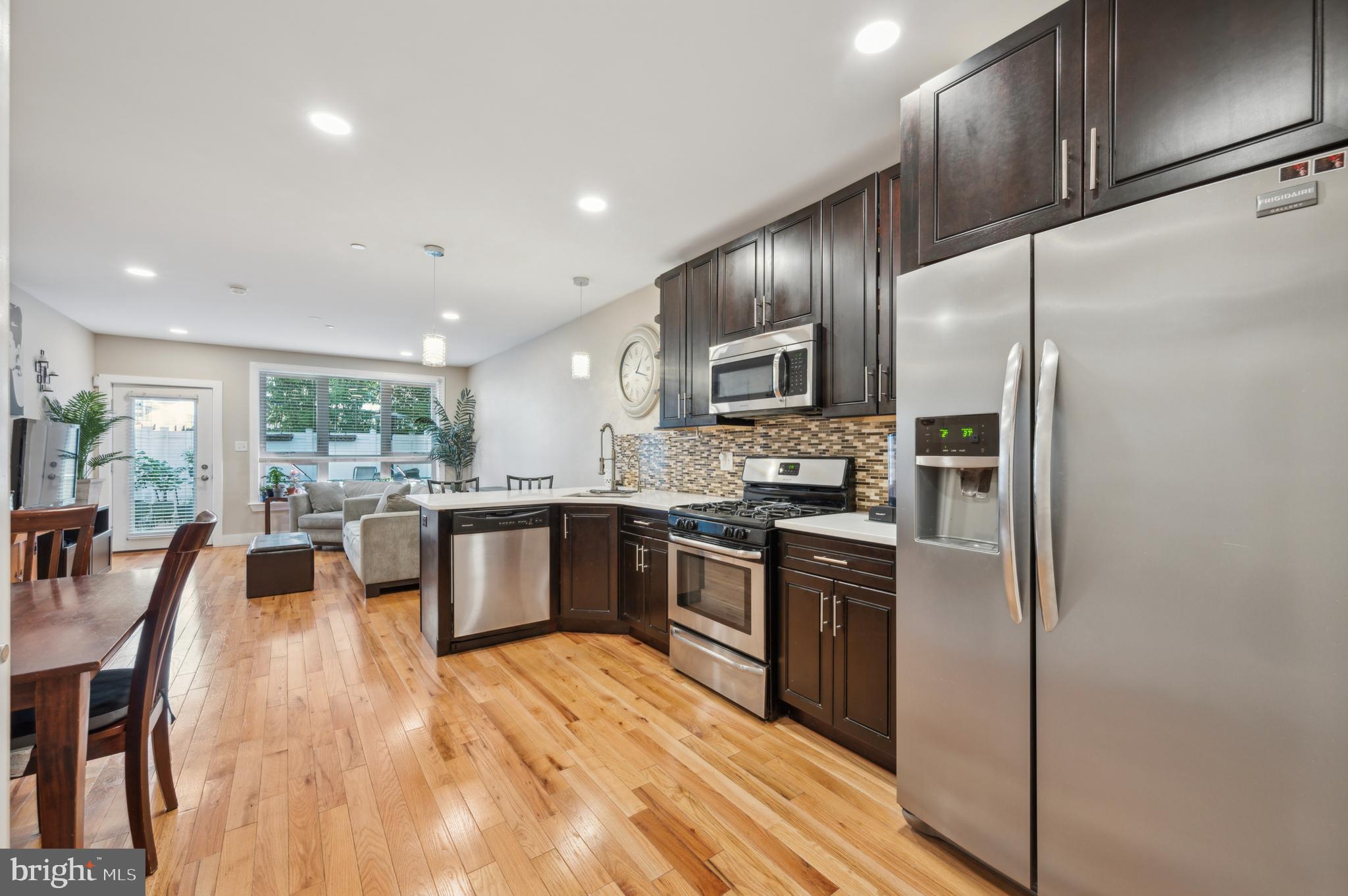 a large kitchen with stainless steel appliances kitchen island granite countertop a large counter top stainless steel appliances and cabinets