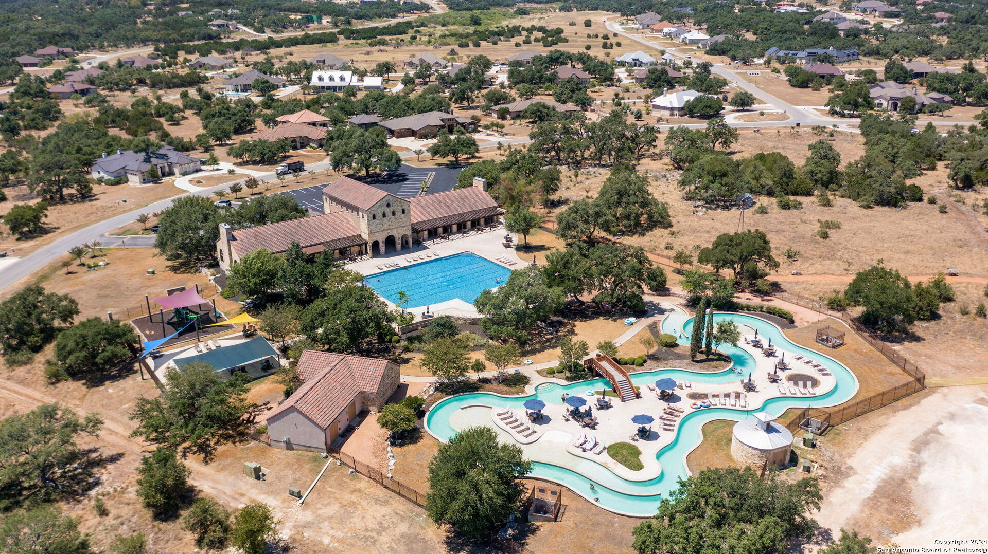 an aerial view of residential houses with outdoor space