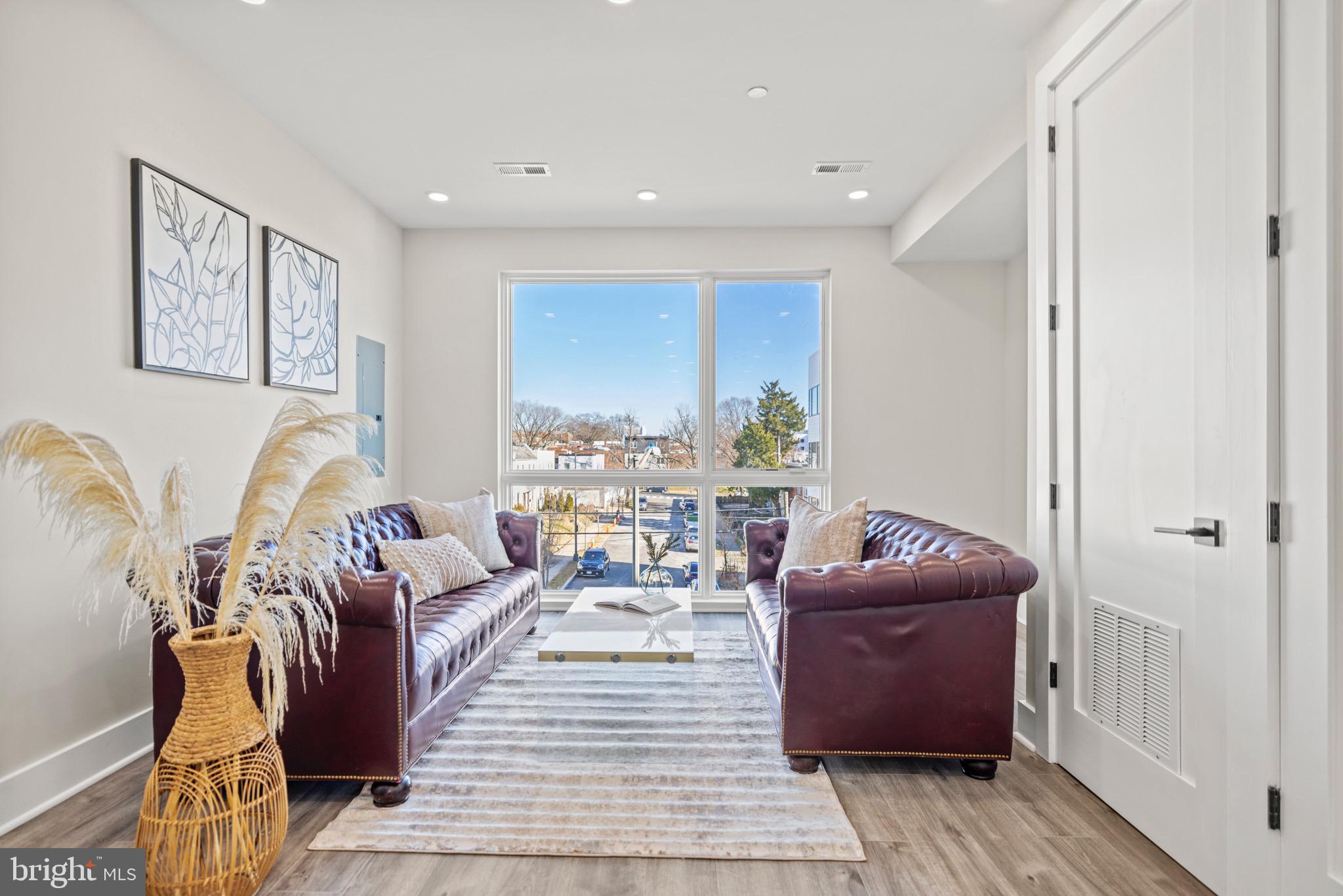 a living room with furniture a couch and a table