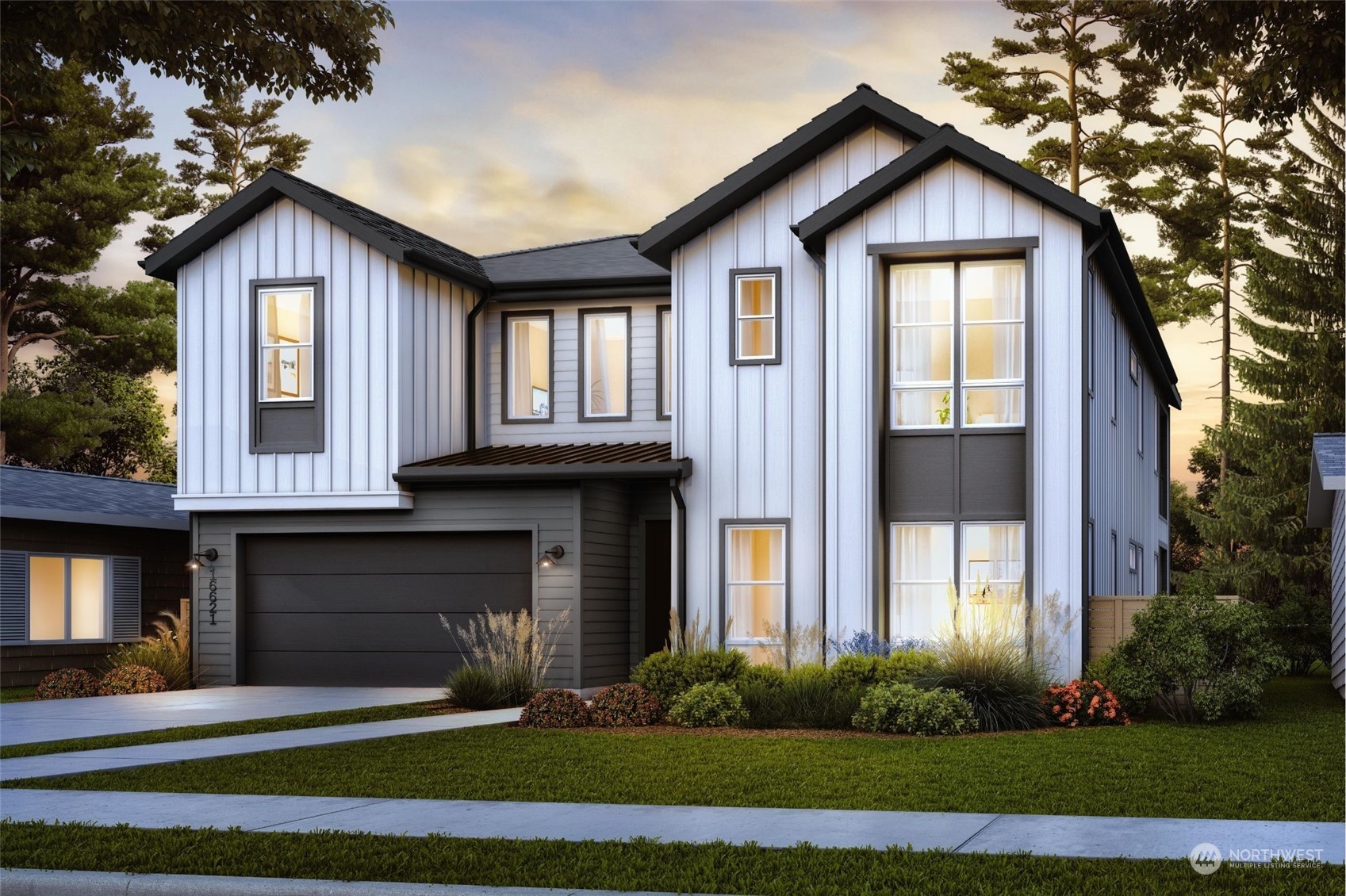 a front view of a house with a yard and garage