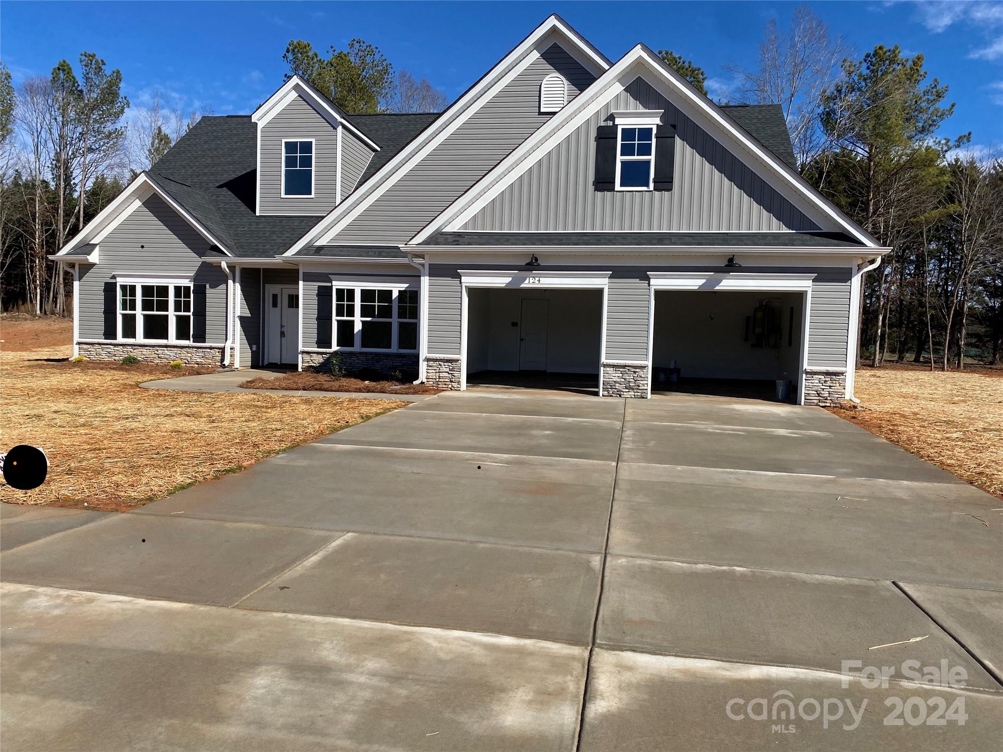 a front view of a house with a garage