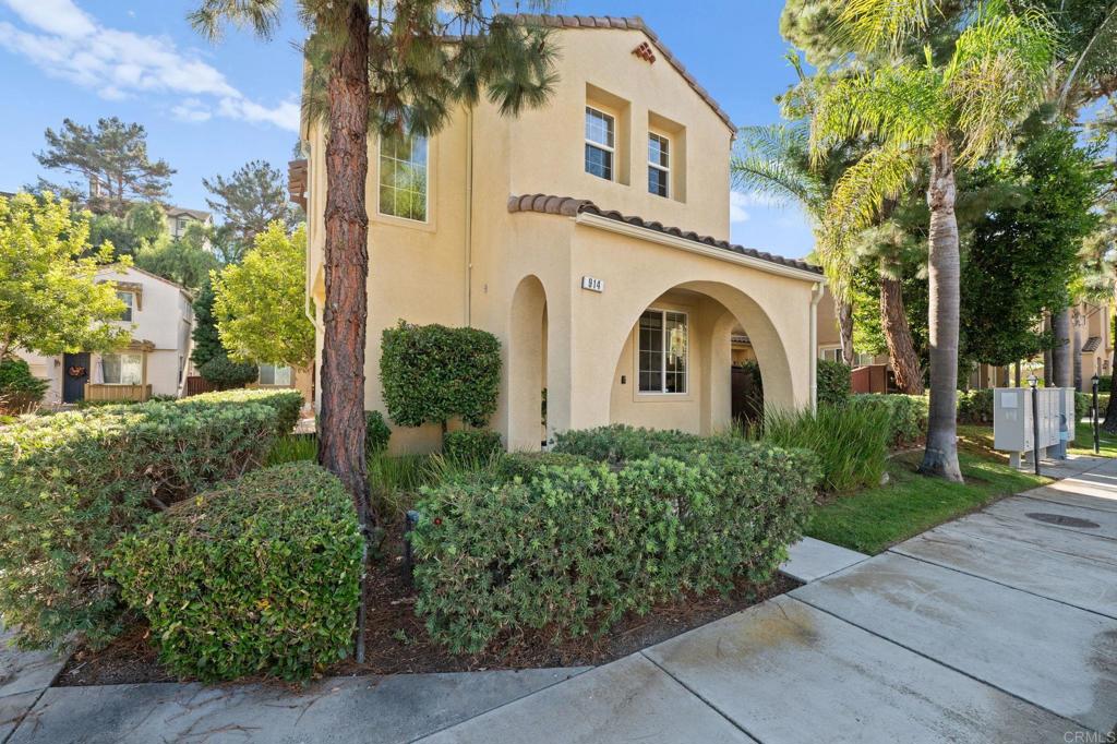 front view of a house with a garden