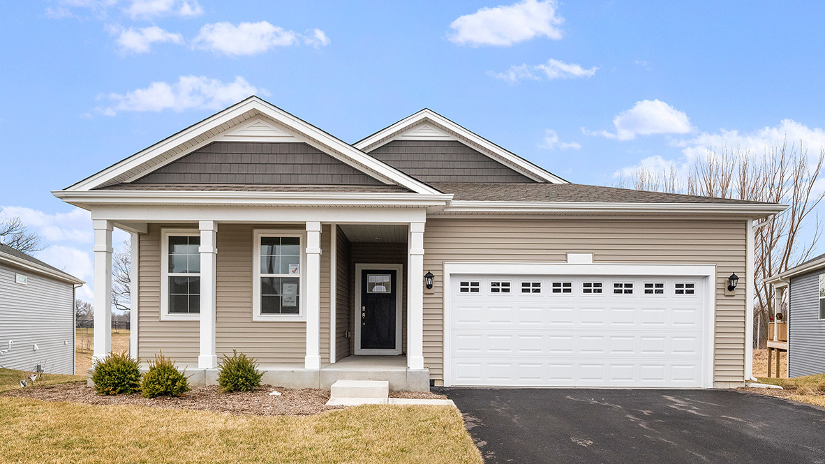 a front view of a house with a garage