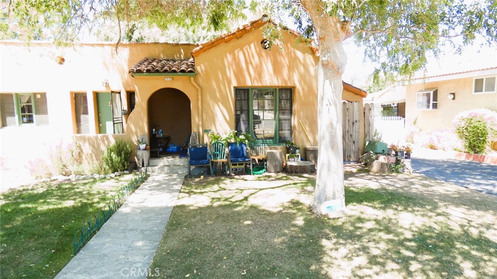 a view of yard with patio