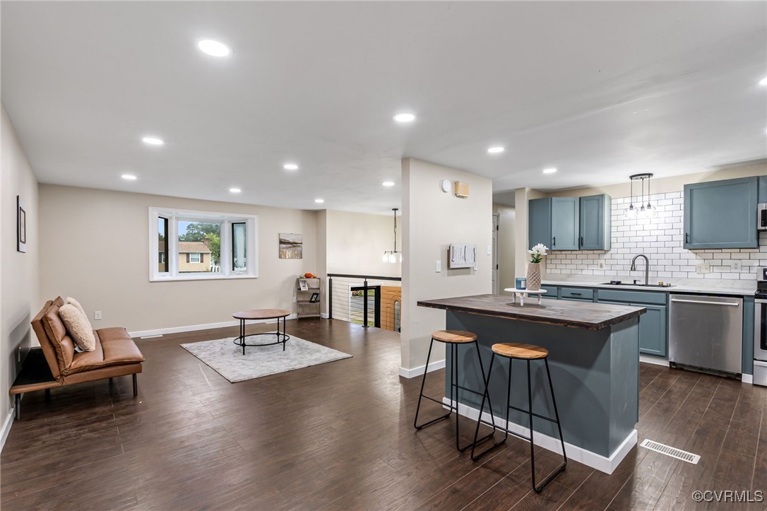 a large kitchen with a table and chairs in it