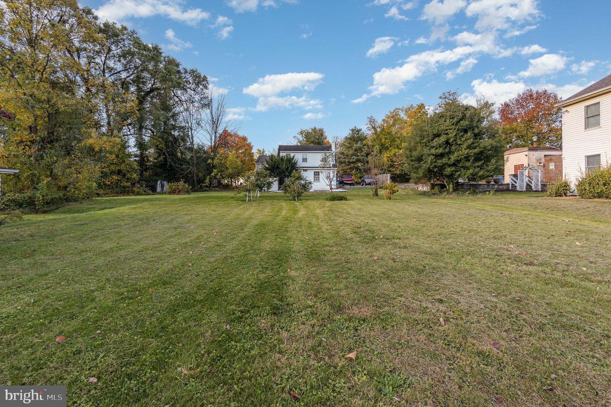 a view of a field with an trees