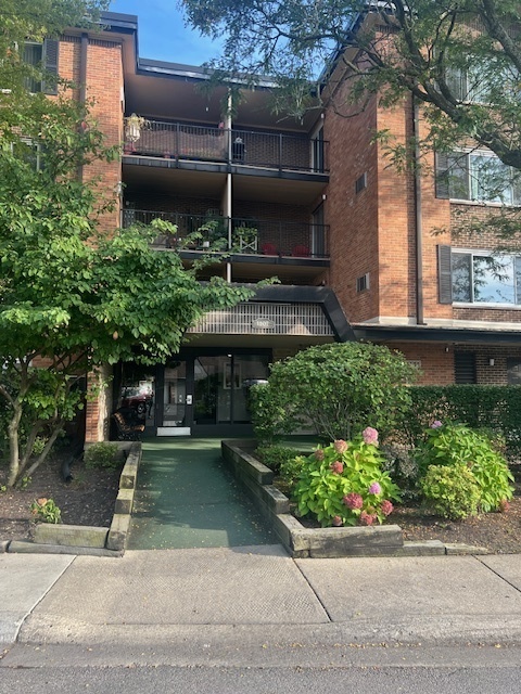 a view of a building with a garden