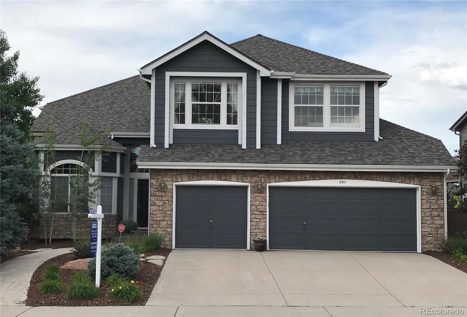 a front view of a house with garage