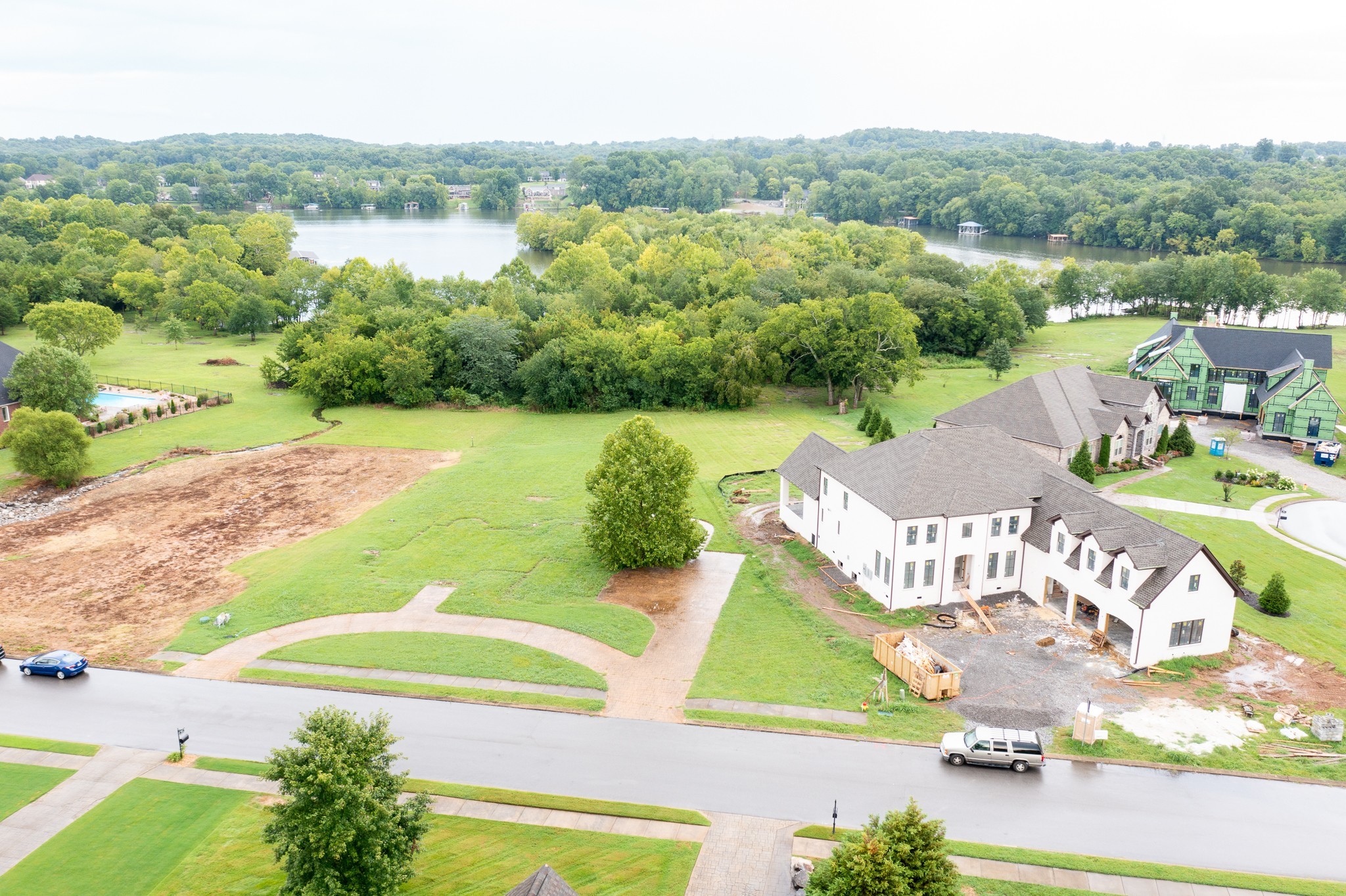 an aerial view of a house with yard swimming pool and outdoor seating