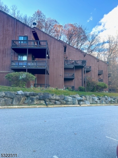 a view of a house with a yard and plants