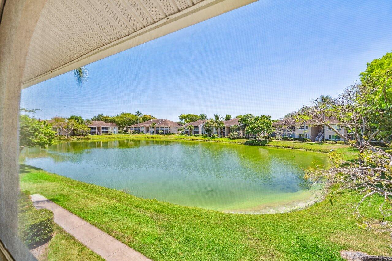 a view of a lake with houses in the back