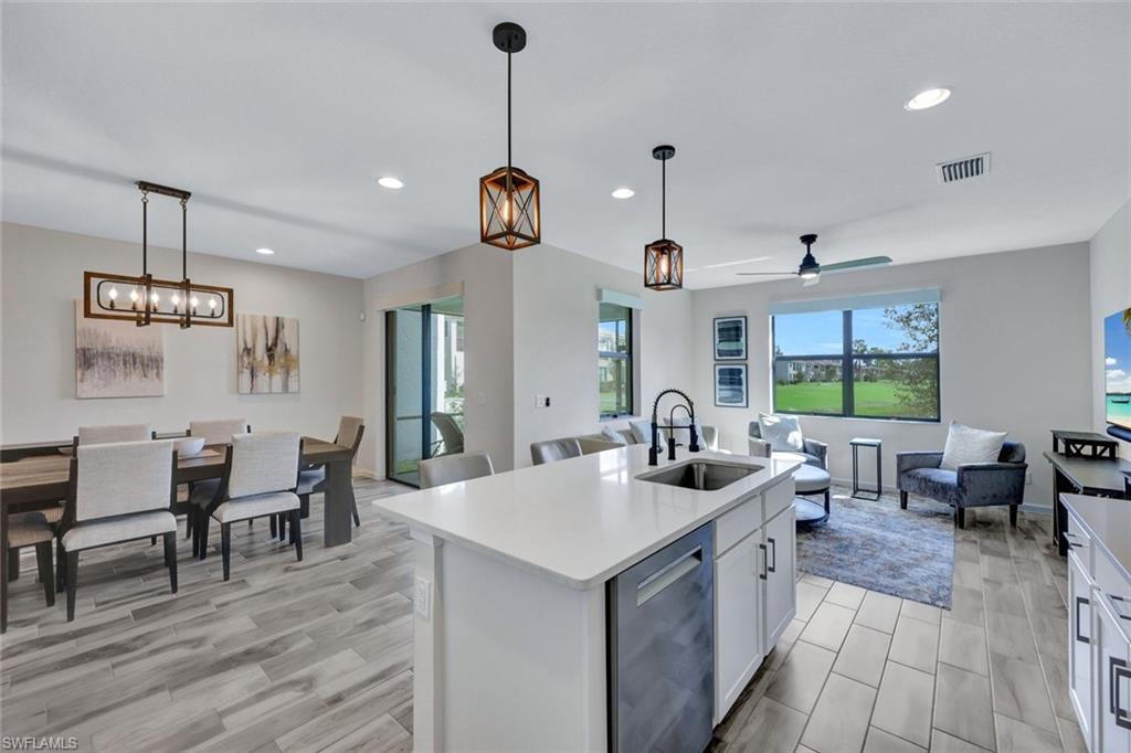 a kitchen with sink and center island