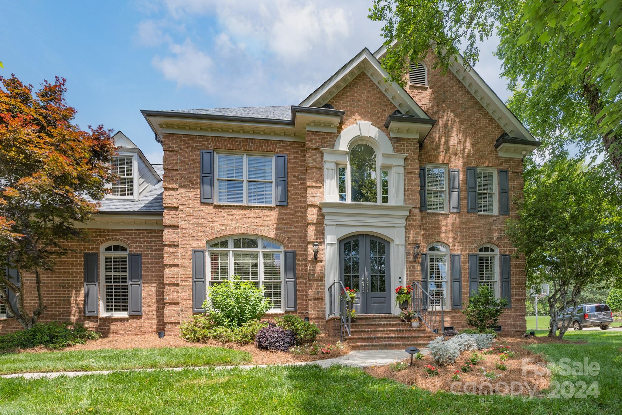 a front view of a house with a yard