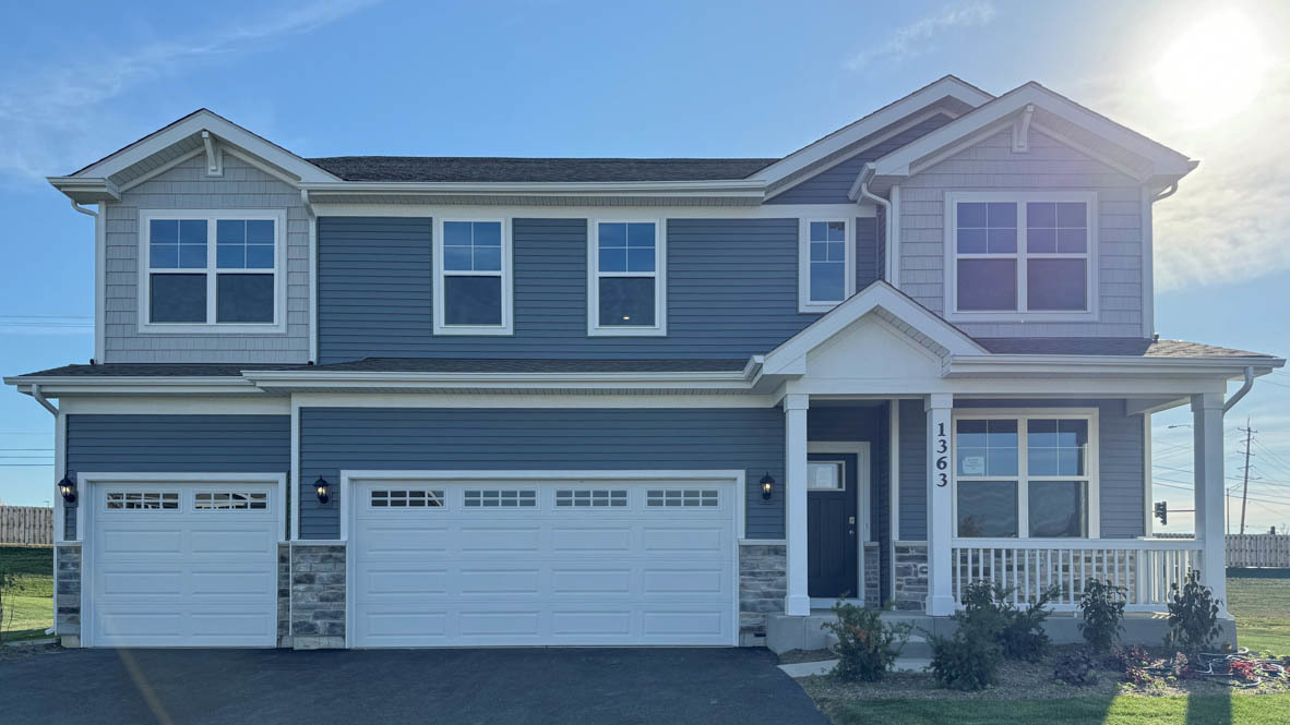 front view of a house and a yard