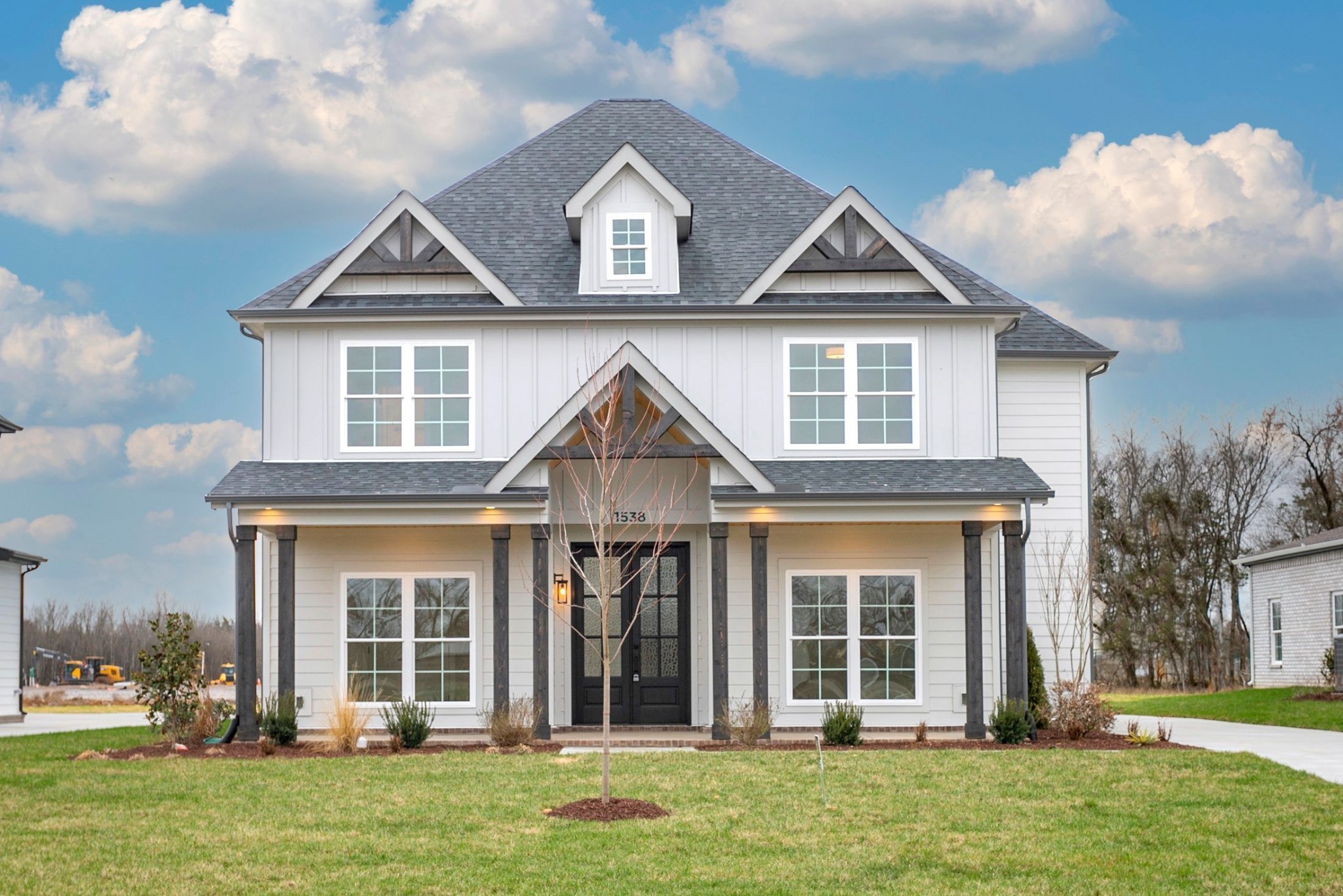 front view of a house with a yard