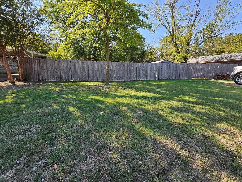 a view of outdoor space with deck and yard