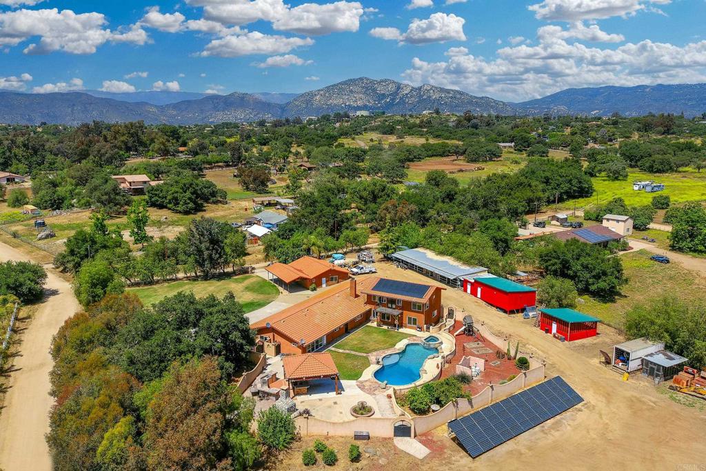 an aerial view of house with yard