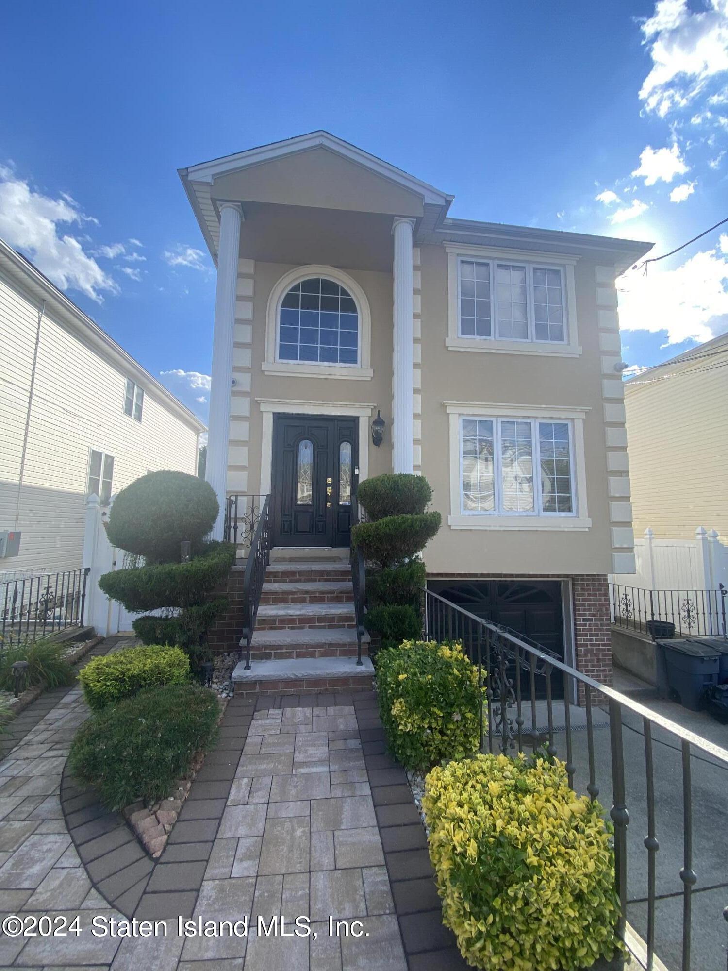 a front view of a house with a yard