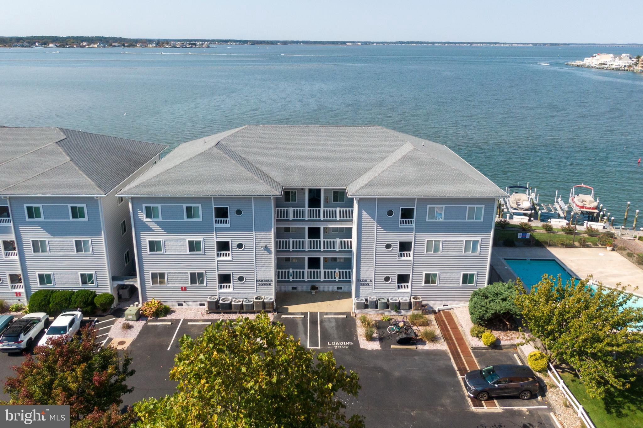 a aerial view of a house with outdoor seating and city view