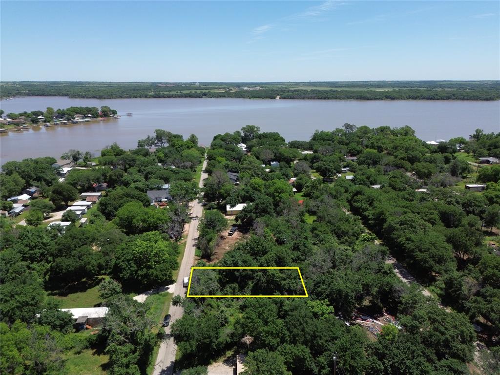 an aerial view of a houses with lake view