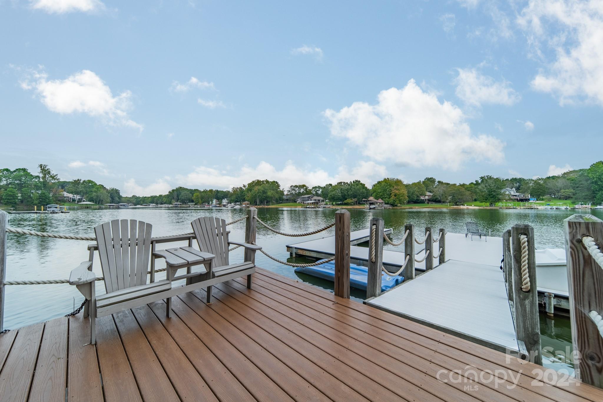 a view of a lake with outdoor seating