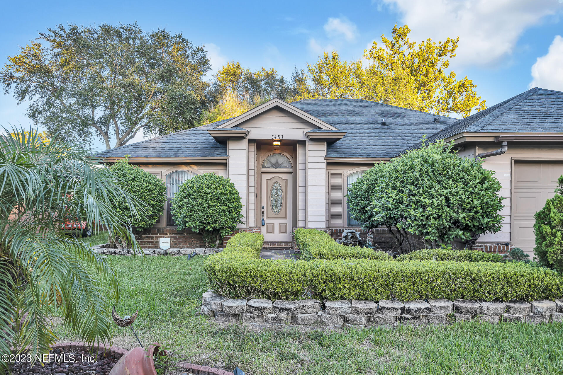 a front view of a house with a yard