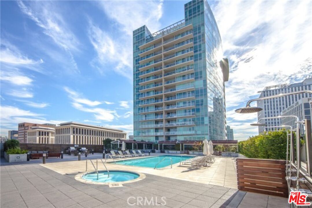 a building view with sitting space and pool view