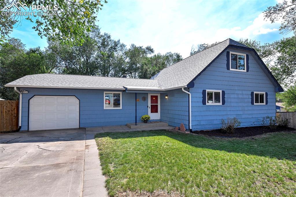 a front view of a house with a yard