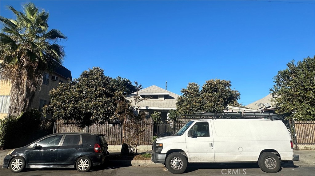 a view of a car parked in front of a house