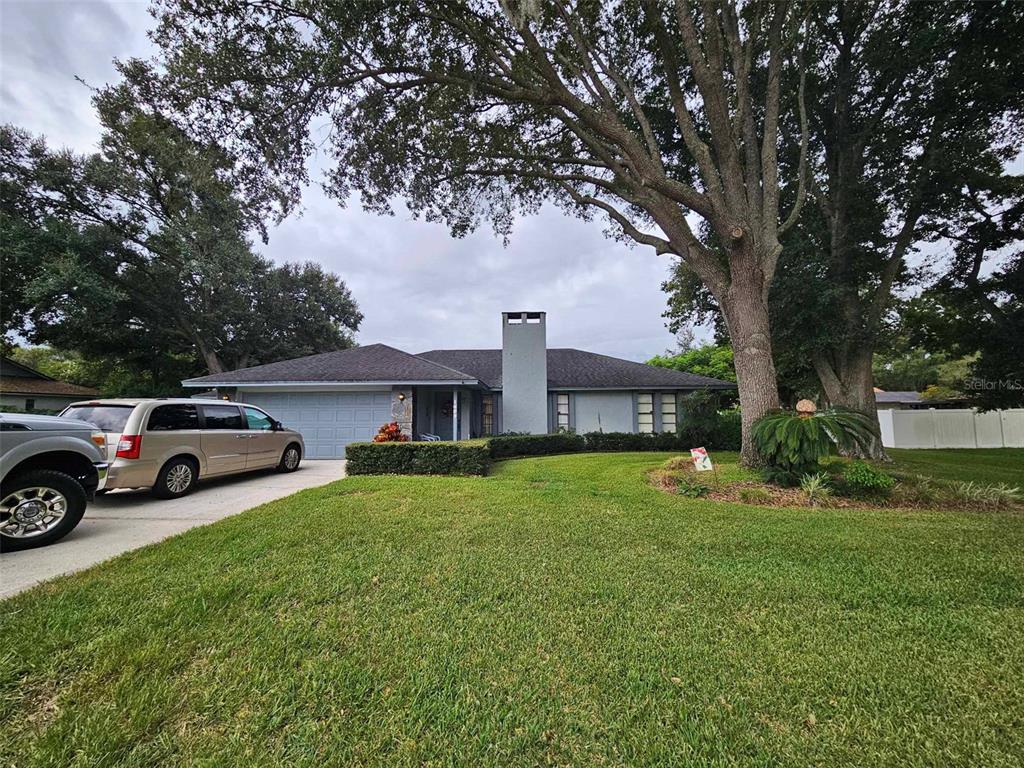 a view of a house with a back yard