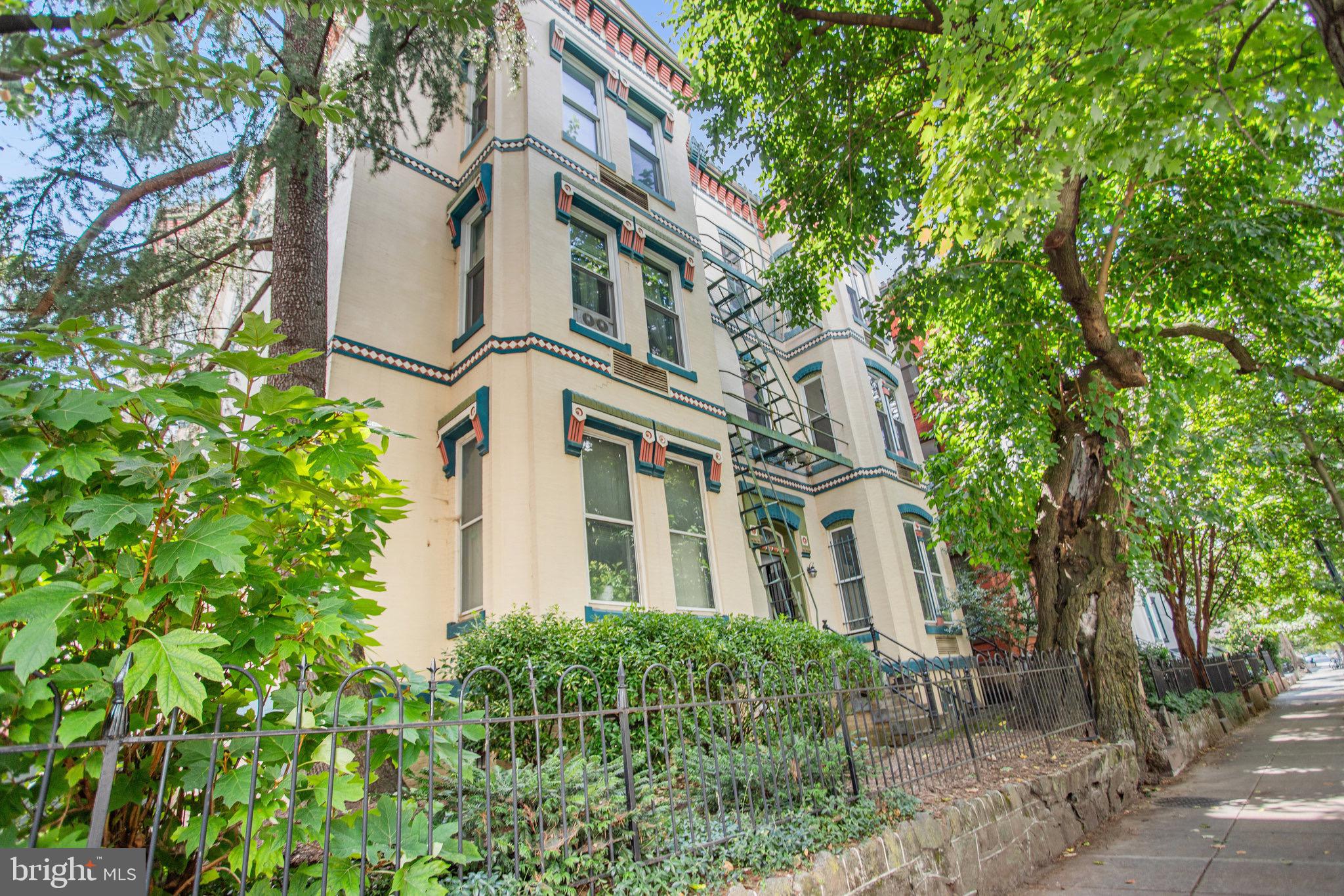 front view of a house with a tree