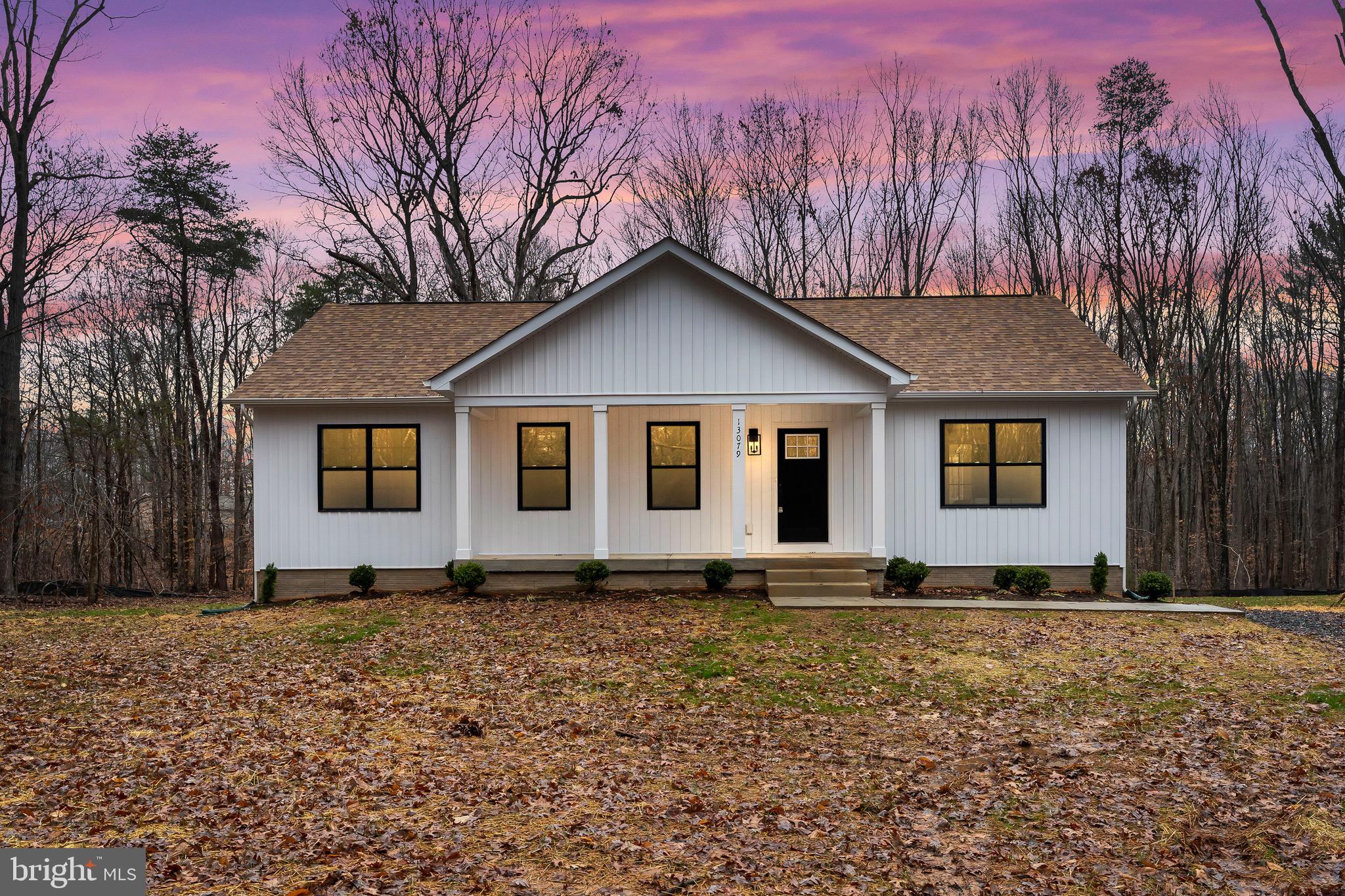 a house with trees in the background