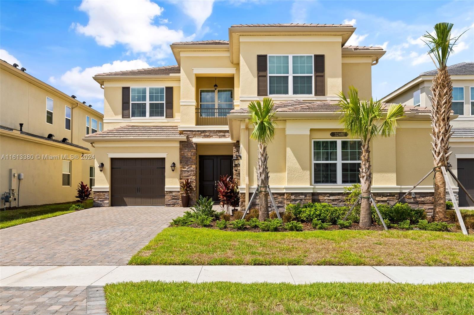 a front view of a house with a yard