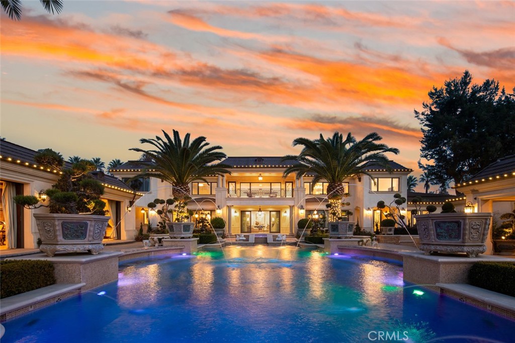 a view of building with swimming pool and furniture