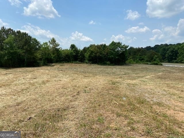 a view of empty pool with green space