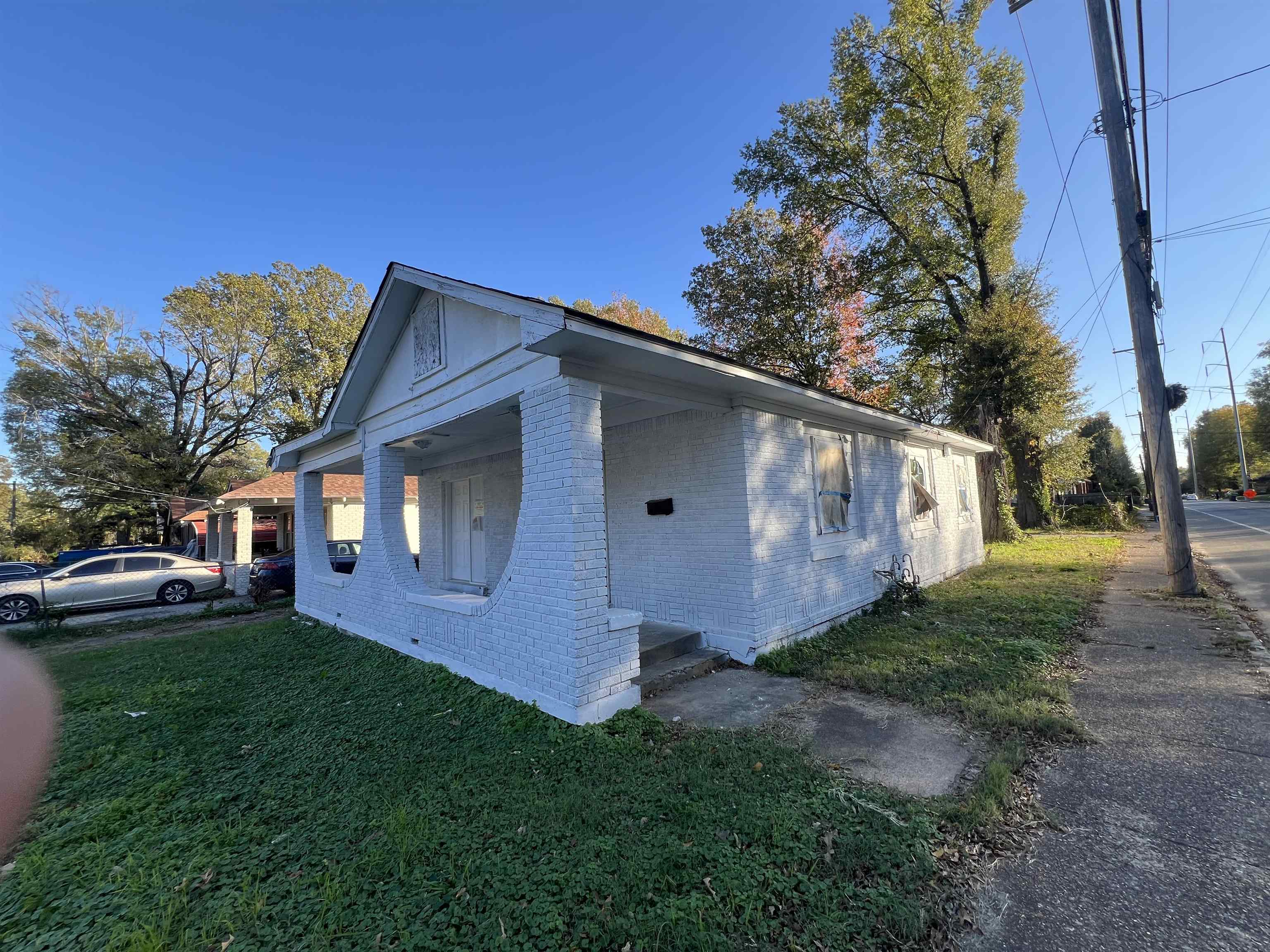 View of property exterior featuring a yard