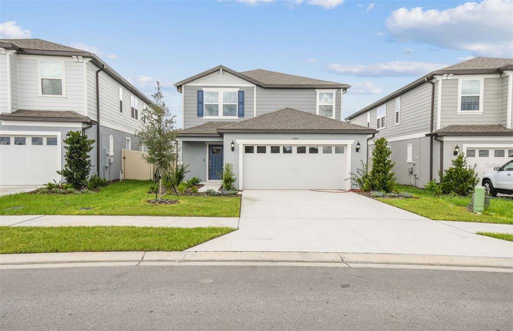 a front view of a house with a yard