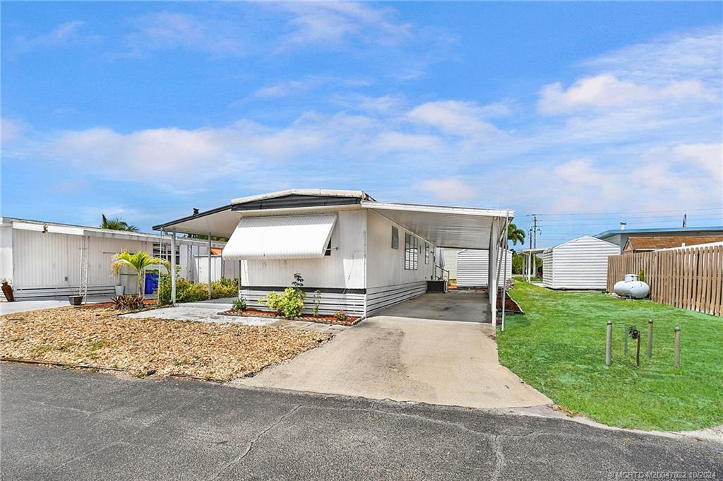 a house with yard in front of it