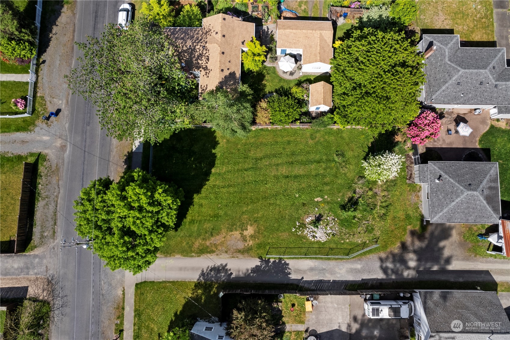 an aerial view of residential house with yard