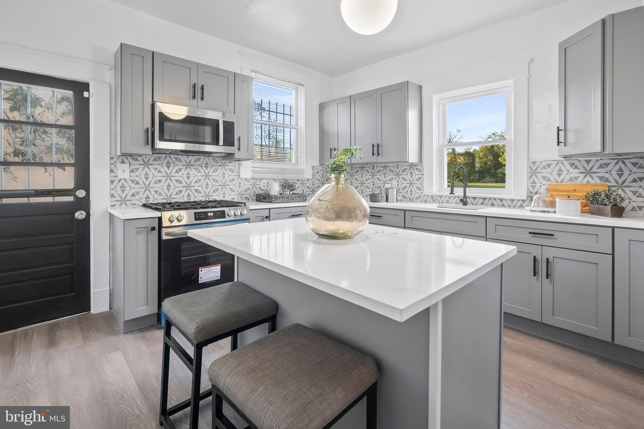 a kitchen with appliances cabinets and a sink