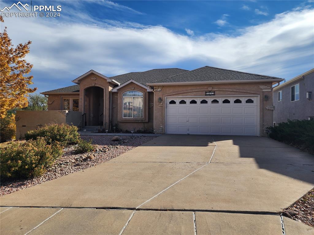 Ranch-style home featuring a garage