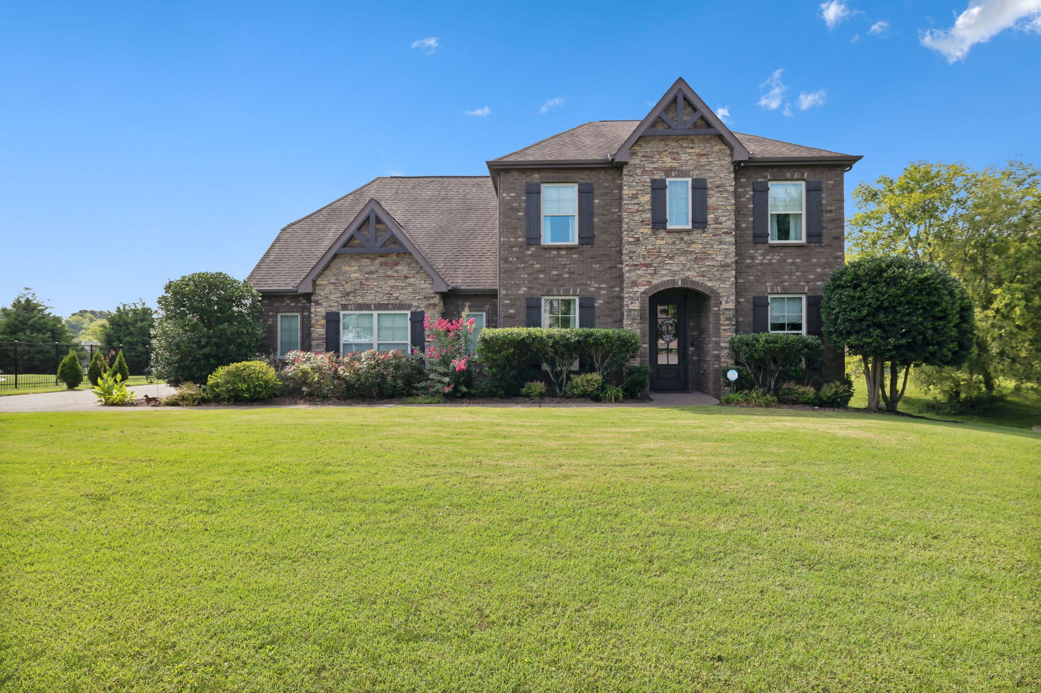 a front view of a house with a yard