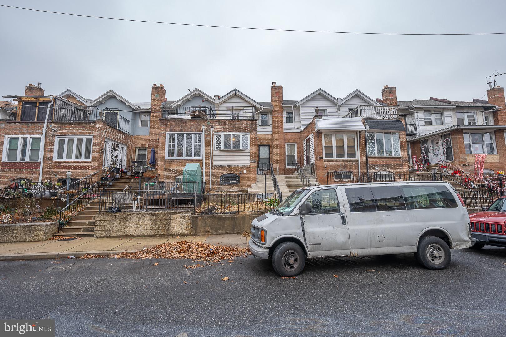 a view of a car parked in front of a house