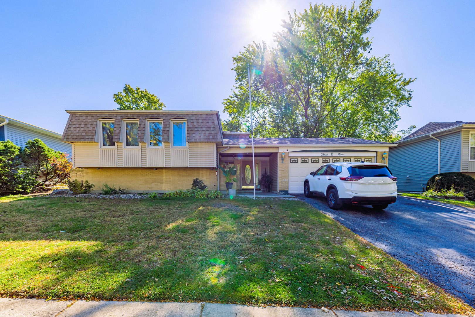 a front view of house with yard and seating space