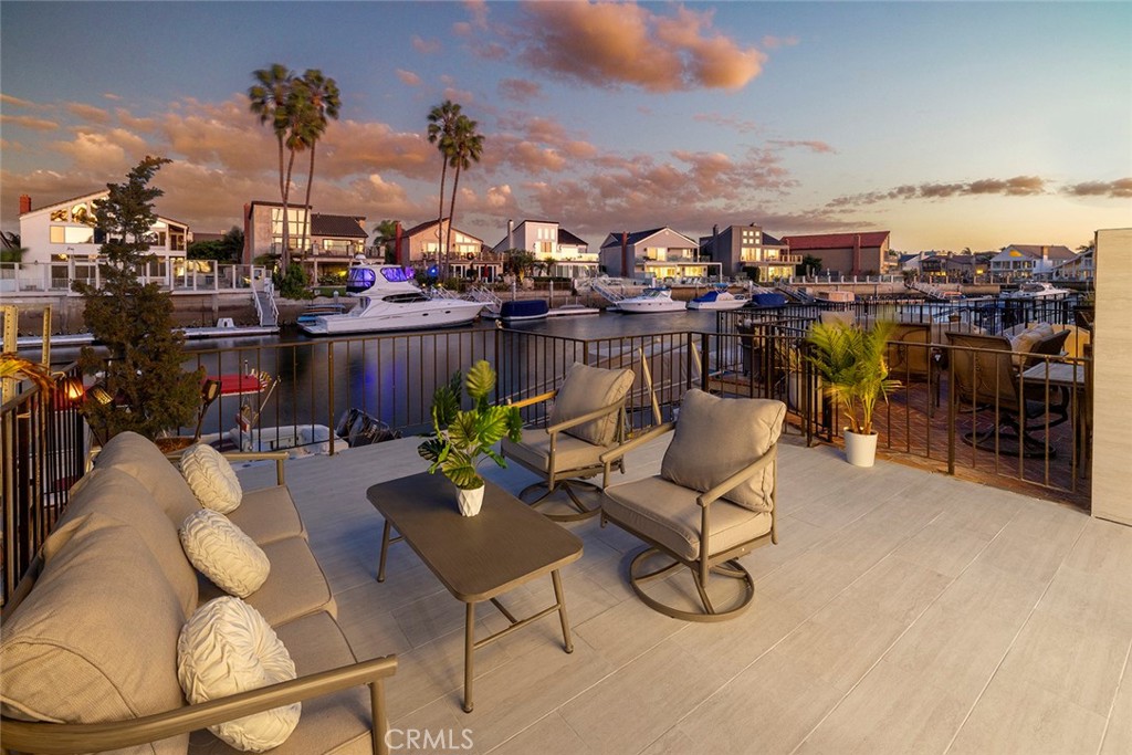 a view of a chairs and table in patio